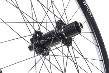 <h1>Rear Hub</h1><i>We create wheels to match the needs of riders who want the most from their wheels. The DH hubs have been chosen to increase stiffness, bearing durability and overall strength of your wheelset. On the rear, the RapidEngage MTB hubs with a superfast 3° engagement, means you will be able to put the power down straight out of the corners.</i>