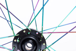 <h1>Oil-Slick Spokes</h1><i>We can also give the spokes a Ti-Nitride coating which not only gives them an eye-catching oil slick rainbow look but also improves wear and corrosion resistance due to the super-hard micro hardness of this coating. The coating is multi-compounded by ceramics and transition metal, so the bonding force between coating and base is immensely improved. This results in a really long lasting finish.</i>