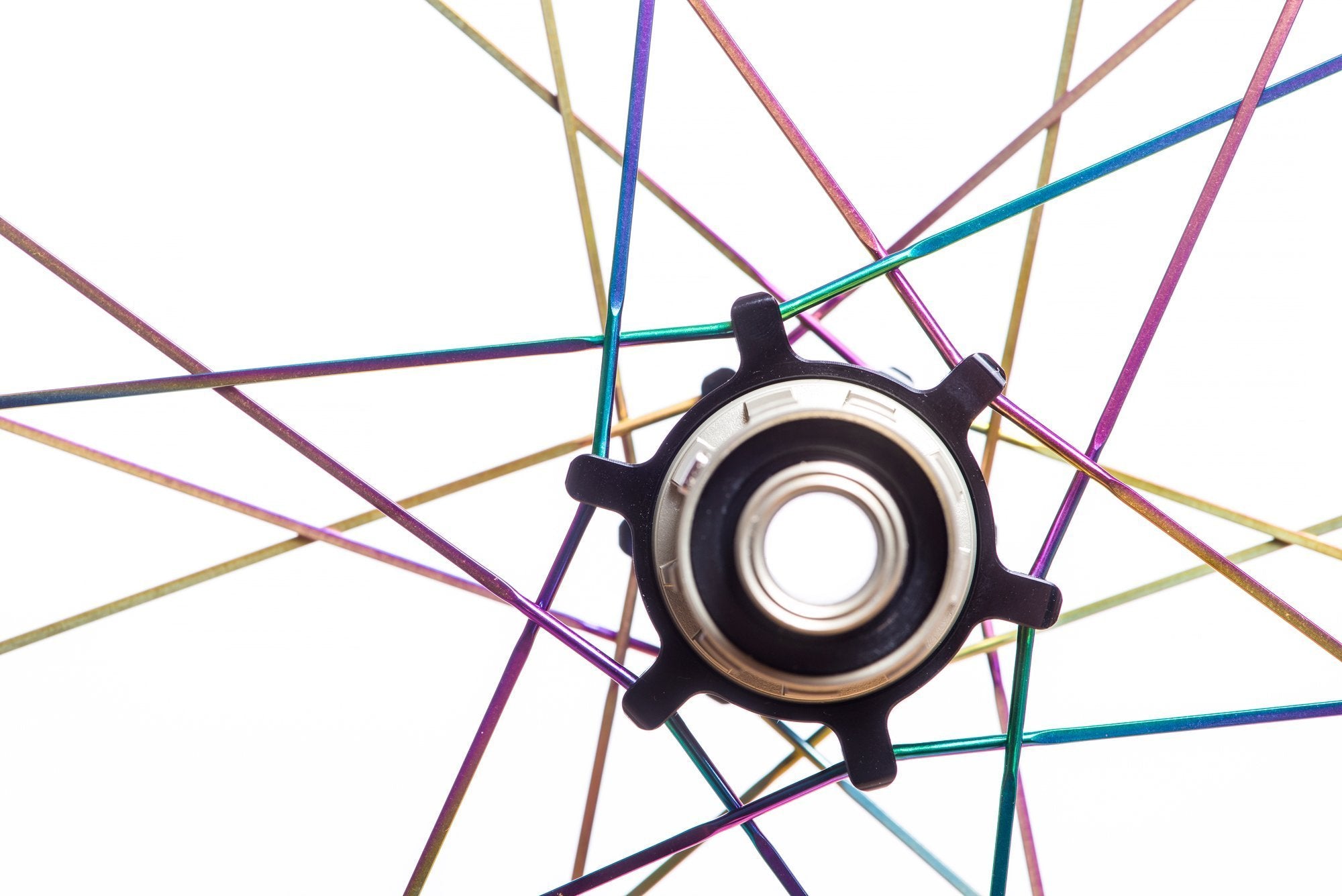 <h1>Oil-Slick Spokes</h1><i>We can also give the spokes a Ti-Nitride coating which not only gives them an eye-catching oil slick rainbow look but also improves wear and corrosion resistance due to the super-hard micro hardness of this coating. The coating is multi-compounded by ceramics and transition metal, so the bonding force between coating and base is immensely improved. This results in a really long lasting finish.</i>