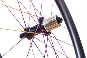 <h1>Hubs</h1><i>Precision machined straight pull hubs and spokes add strength and enhance power transfer meaning all your force pushes you forwards. Large 15mm diameter hub axles for sprinting and out-of-saddle climbing responsiveness. Circular dropout interface steps add extra stiffness.</i>