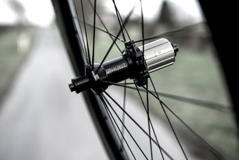 <h1>Hubs</h1><i>Precision machined straight pull hubs and spokes add strength and enhance power transfer meaning all your force pushes you forwards. Large 15mm diameter hub axles for sprinting and out-of-saddle climbing responsiveness. Circular dropout interface steps add extra stiffness.</i>