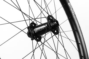 <h1>Front Hub</h1><i>We have gone all out on the front hub and beefed it up over our XCWide and TrailWide wheelsets. Featuring an oversized shell to accommodate larger and extremely durable bearings and 7075-T6 series alloy axles to increase stiffness. These hubs have been selected based on their ability to perform on the most aggressive trails.</i>