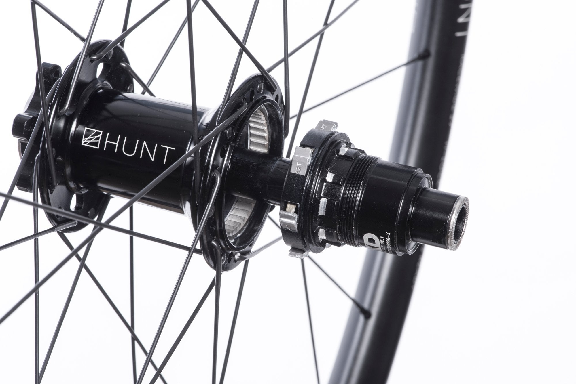 <h1>Rear Hub</h1><i>We create wheels to match the needs of riders who want the most from their wheels. The TrailWide hubs have been chosen to increase stiffness, bearing durability and overall strength of your wheelset. On the rear, the RapidEngage MTB hubs with a superfast 3 degree engagement, means you will be able to put the power down straight out of the corners.</i>