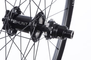 <h1>Rear Hub</h1><i>We create wheels to match the needs of riders who want the most from their wheels. The TrailWide hubs have been chosen to increase stiffness, bearing durability and overall strength of your wheelset. On the rear, the RapidEngage MTB hubs with a superfast 3 degree engagement, means you will be able to put the power down straight out of the corners.</i>